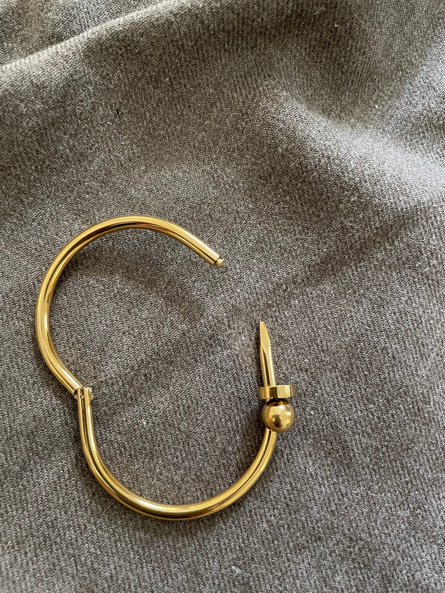 Golden nail bangle