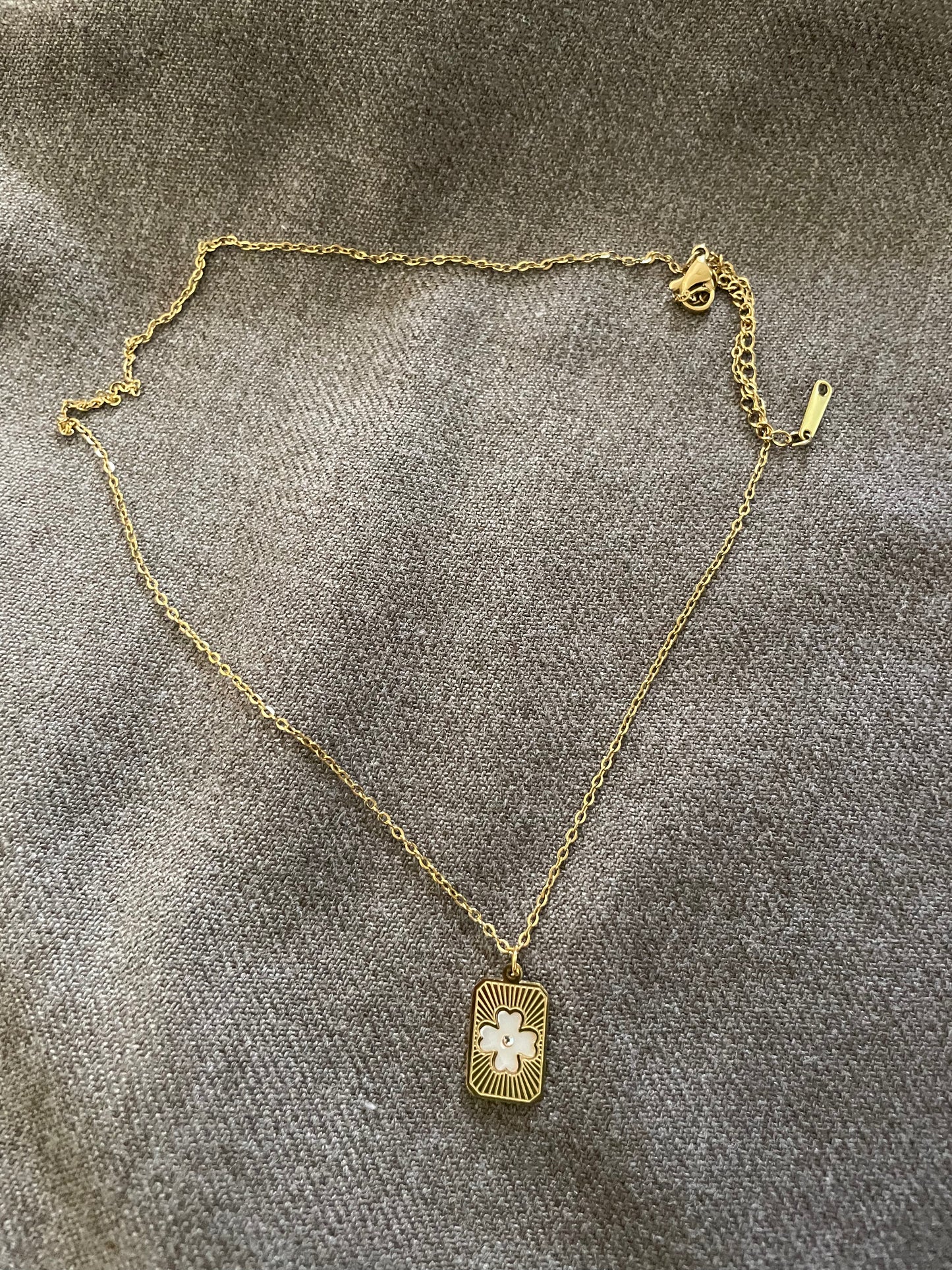 White radiant clover necklace