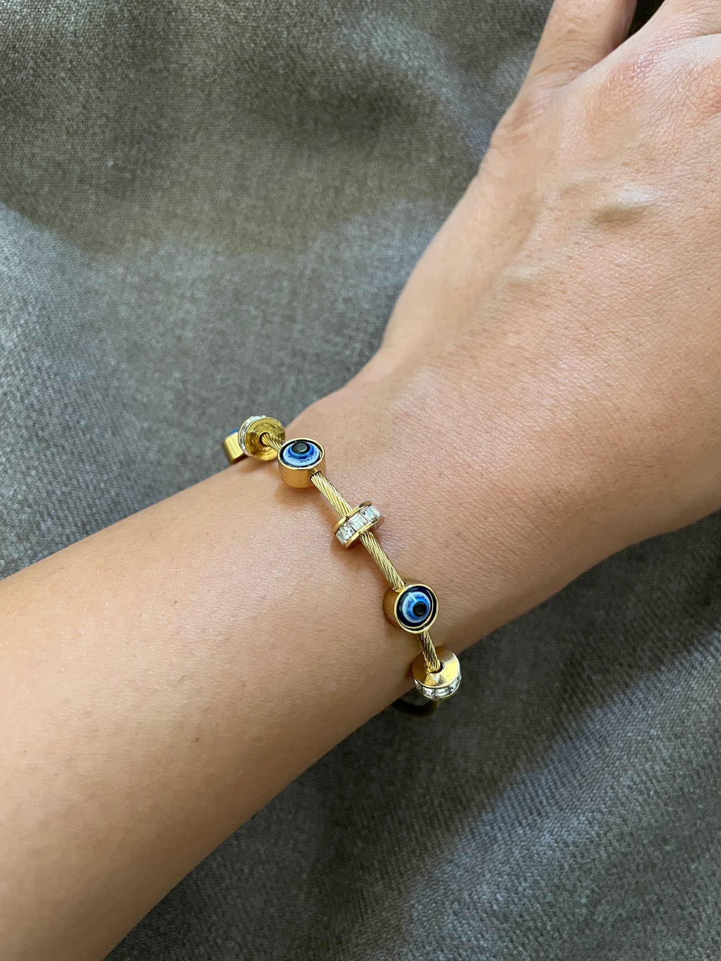 Evil eye gold cable bangle