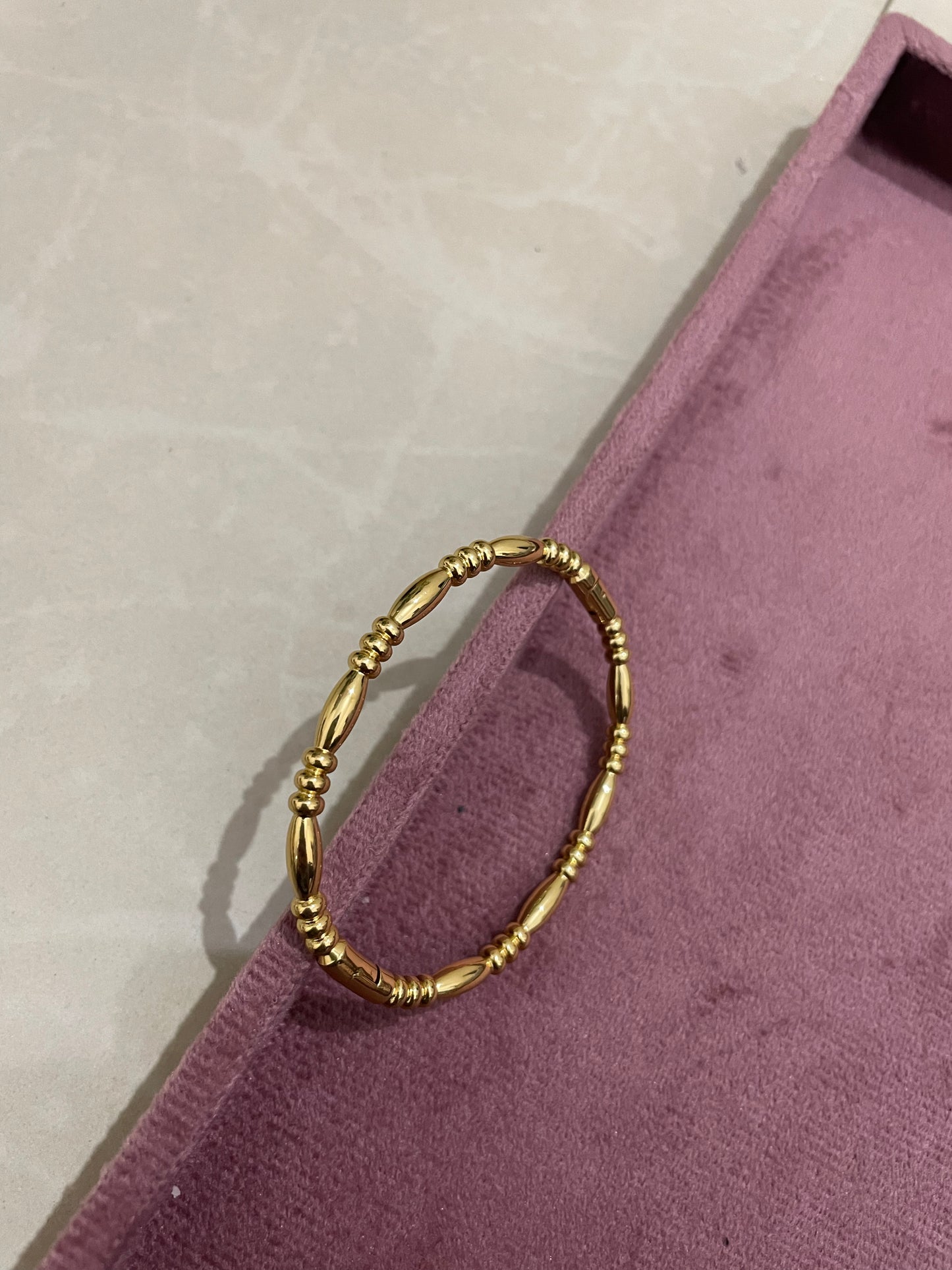 Regal Barrel Bead Gold Bangle