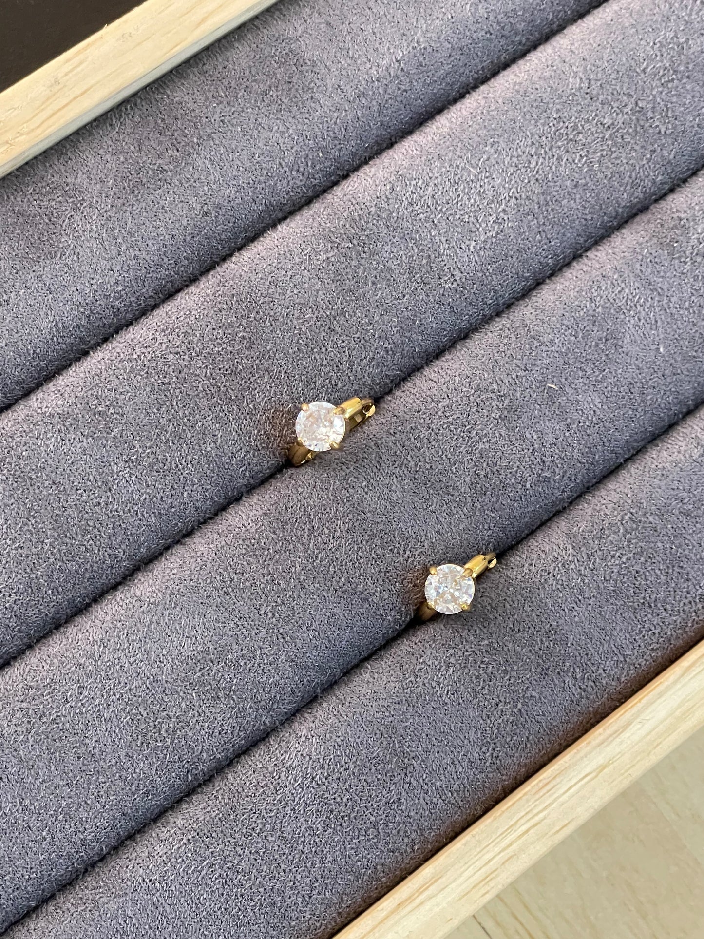 Solitaire Huggie Hoop Earrings.