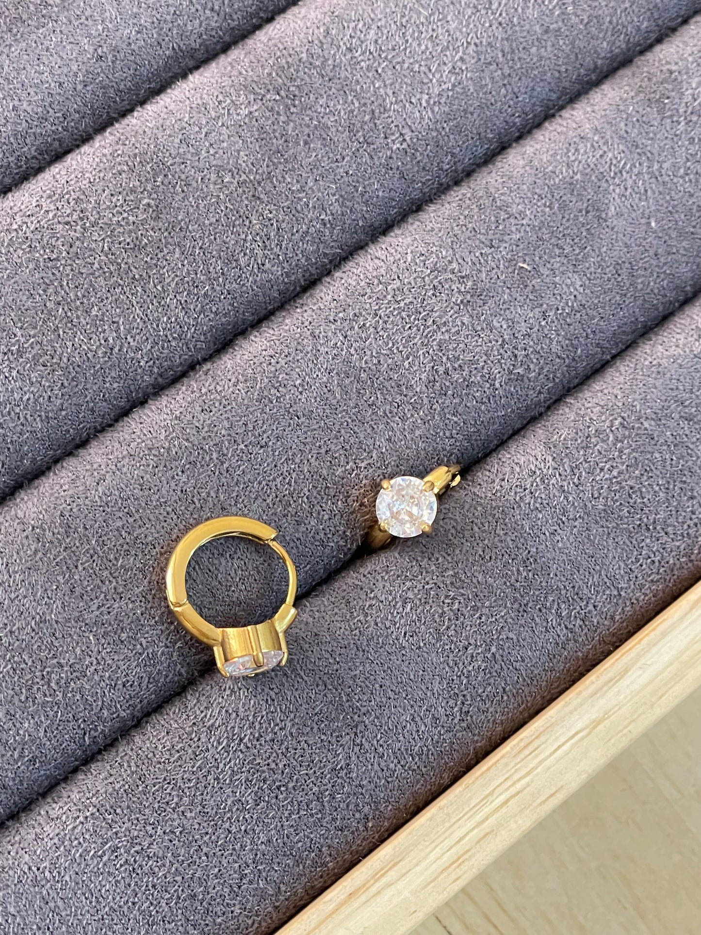 Solitaire Huggie Hoop Earrings.